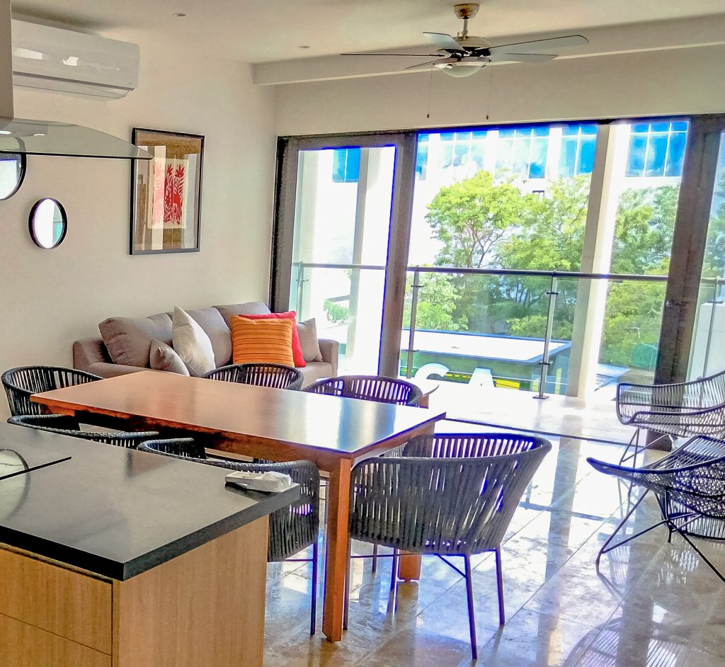 Dining room furnished by Homiture — rental-ready unit in the Riviera Maya