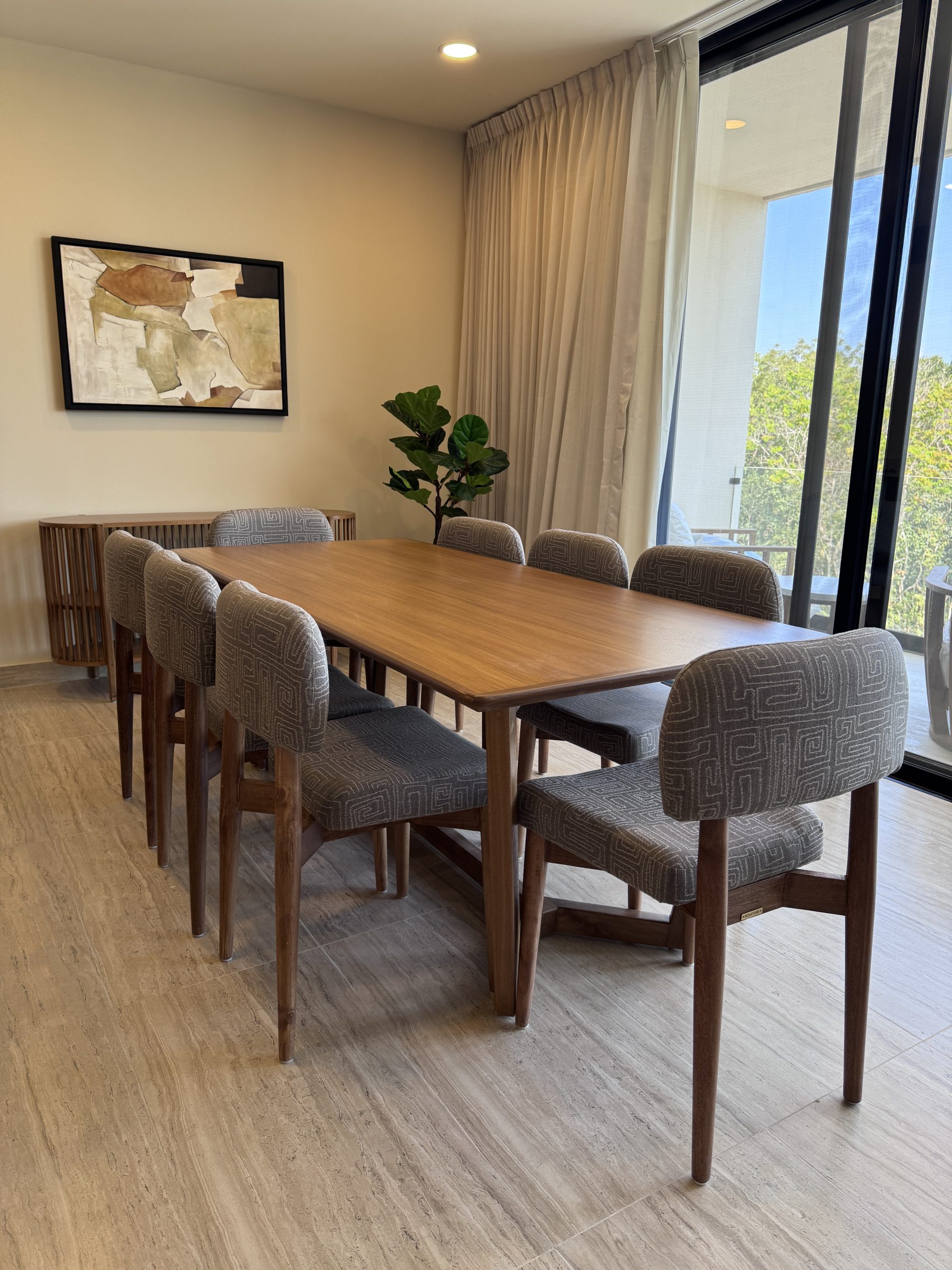 Dining room furnished by Homiture — rental-ready unit in the Riviera Maya