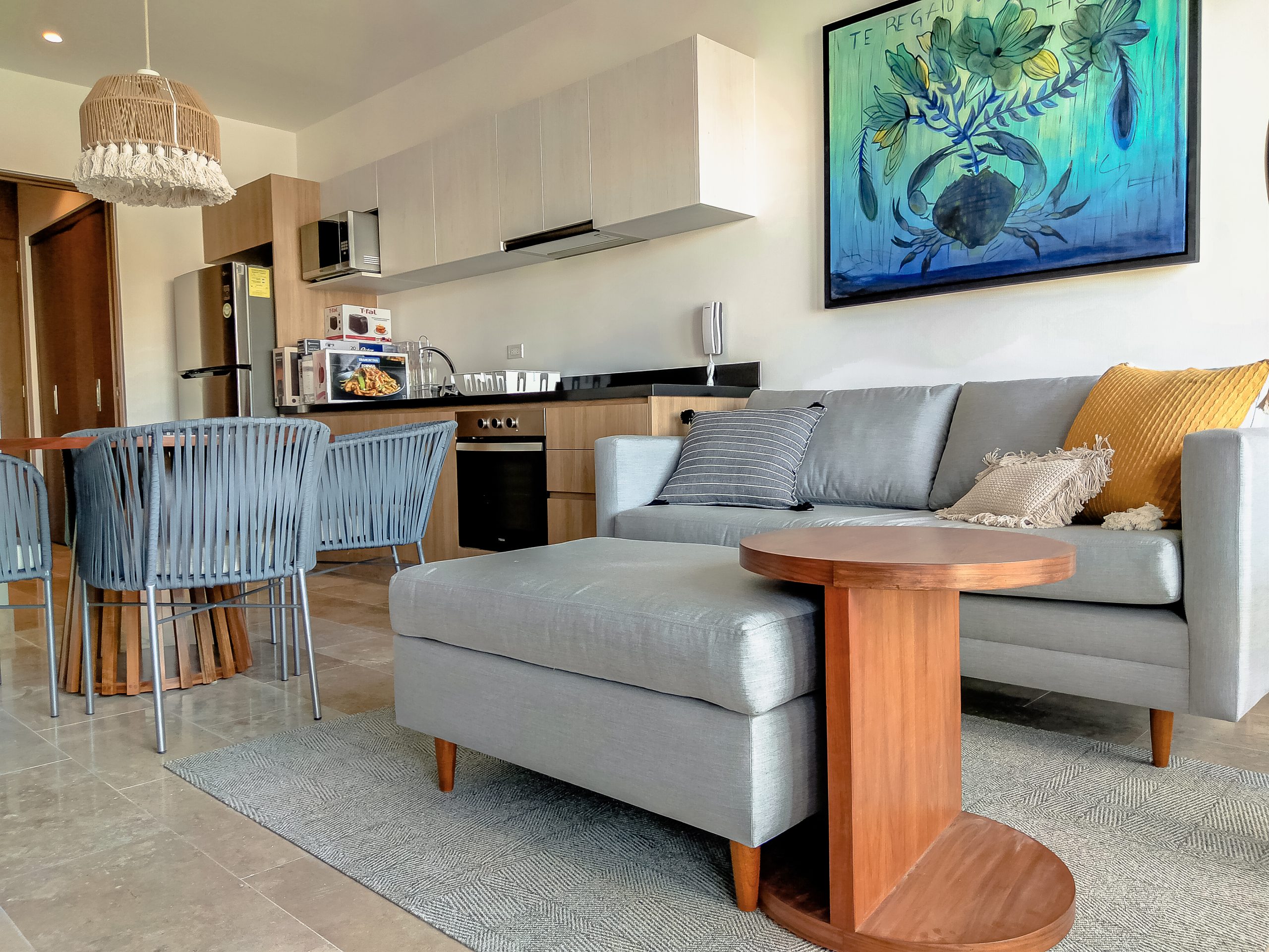 Living room furnished by Homiture — rental-ready unit in the Riviera Maya