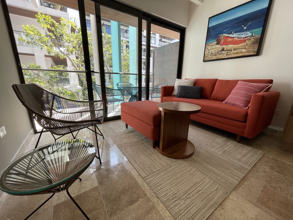 Living room furnished by Homiture — rental-ready unit in the Riviera Maya