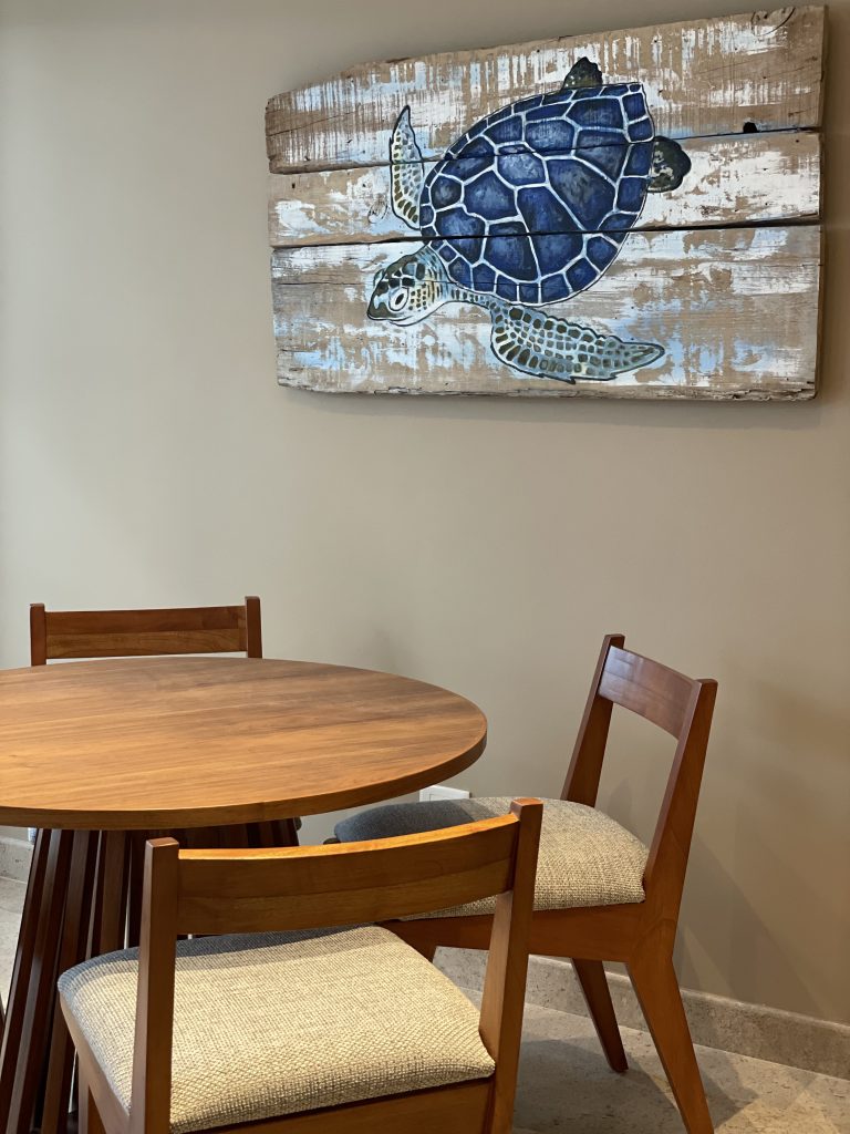Living room furnished by Homiture — rental-ready unit in the Riviera Maya