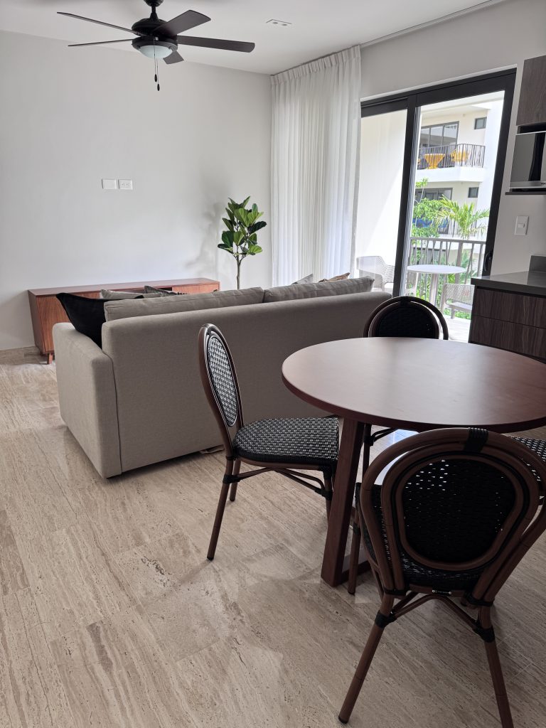 Living room furnished by Homiture — rental-ready unit in the Riviera Maya