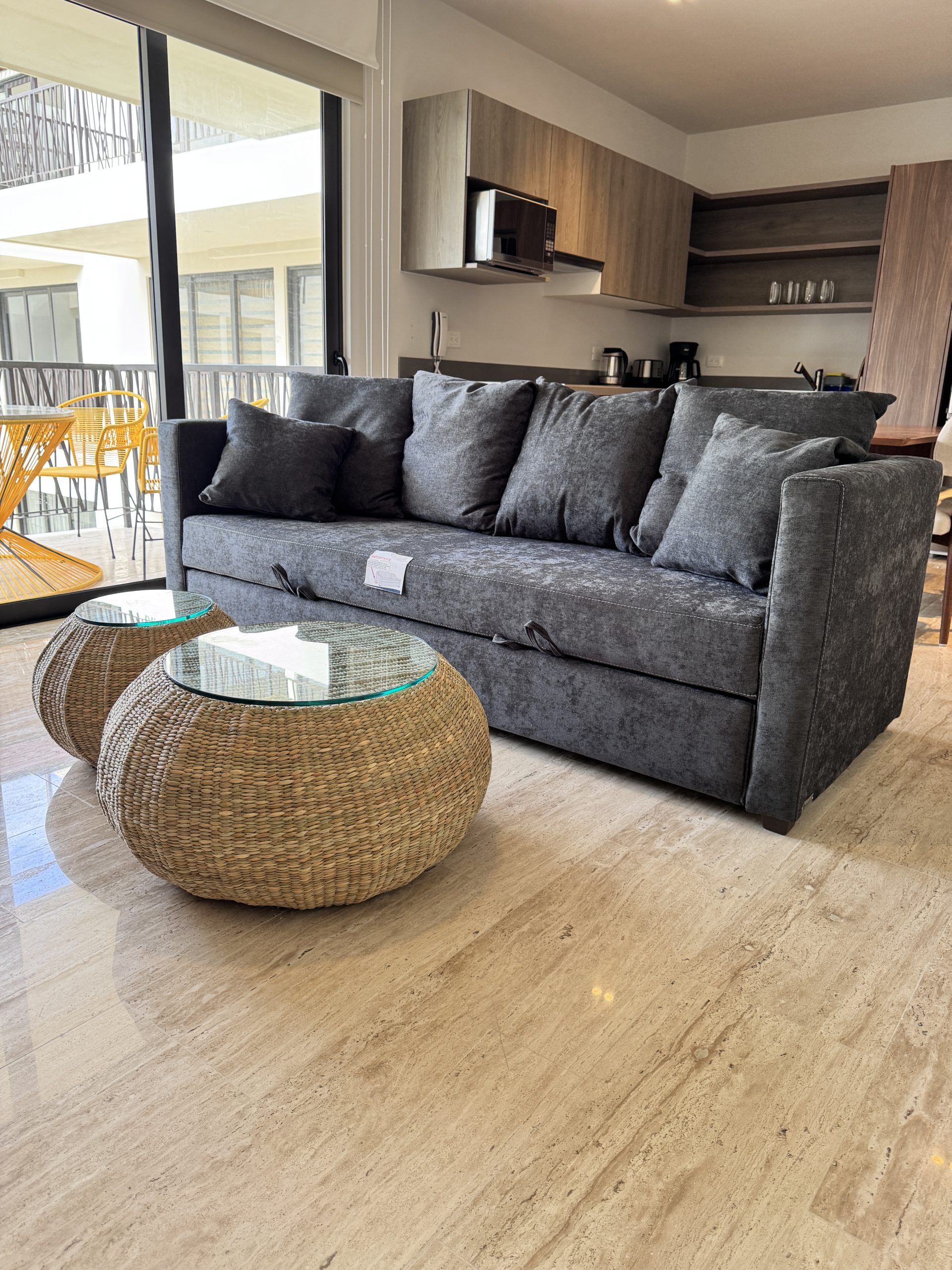 Living room furnished by Homiture — rental-ready unit in the Riviera Maya