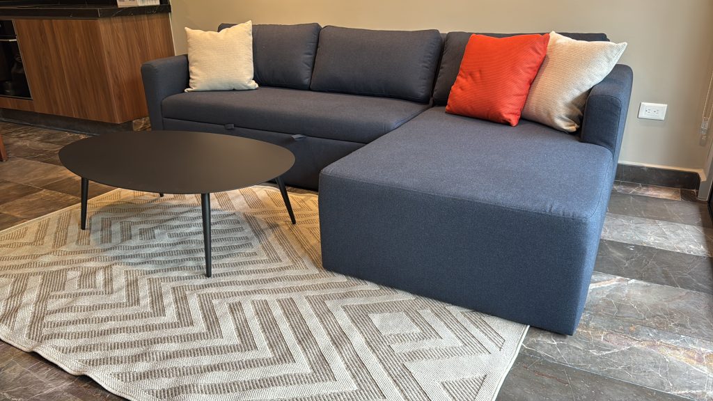 Living room furnished by Homiture — rental-ready unit in the Riviera Maya