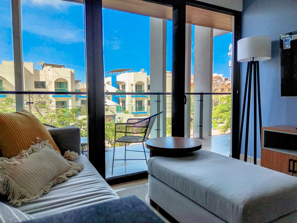 Terrace furnished by Homiture — rental-ready unit in the Riviera Maya